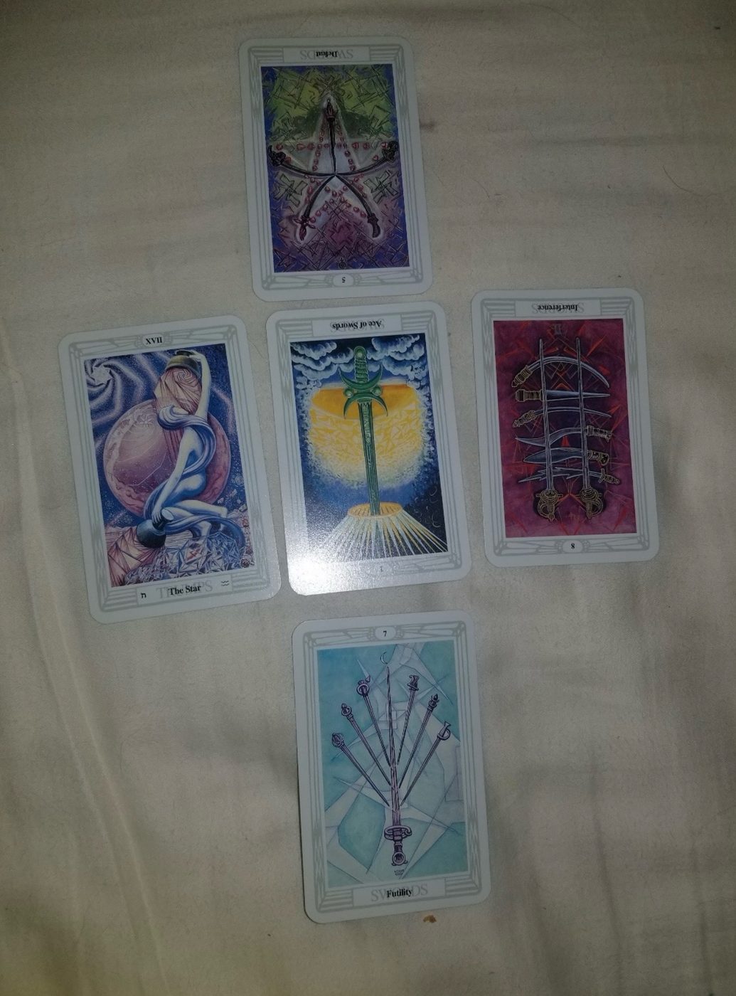 A real tarot card spread from a reading, including The Star and Ace of Swords