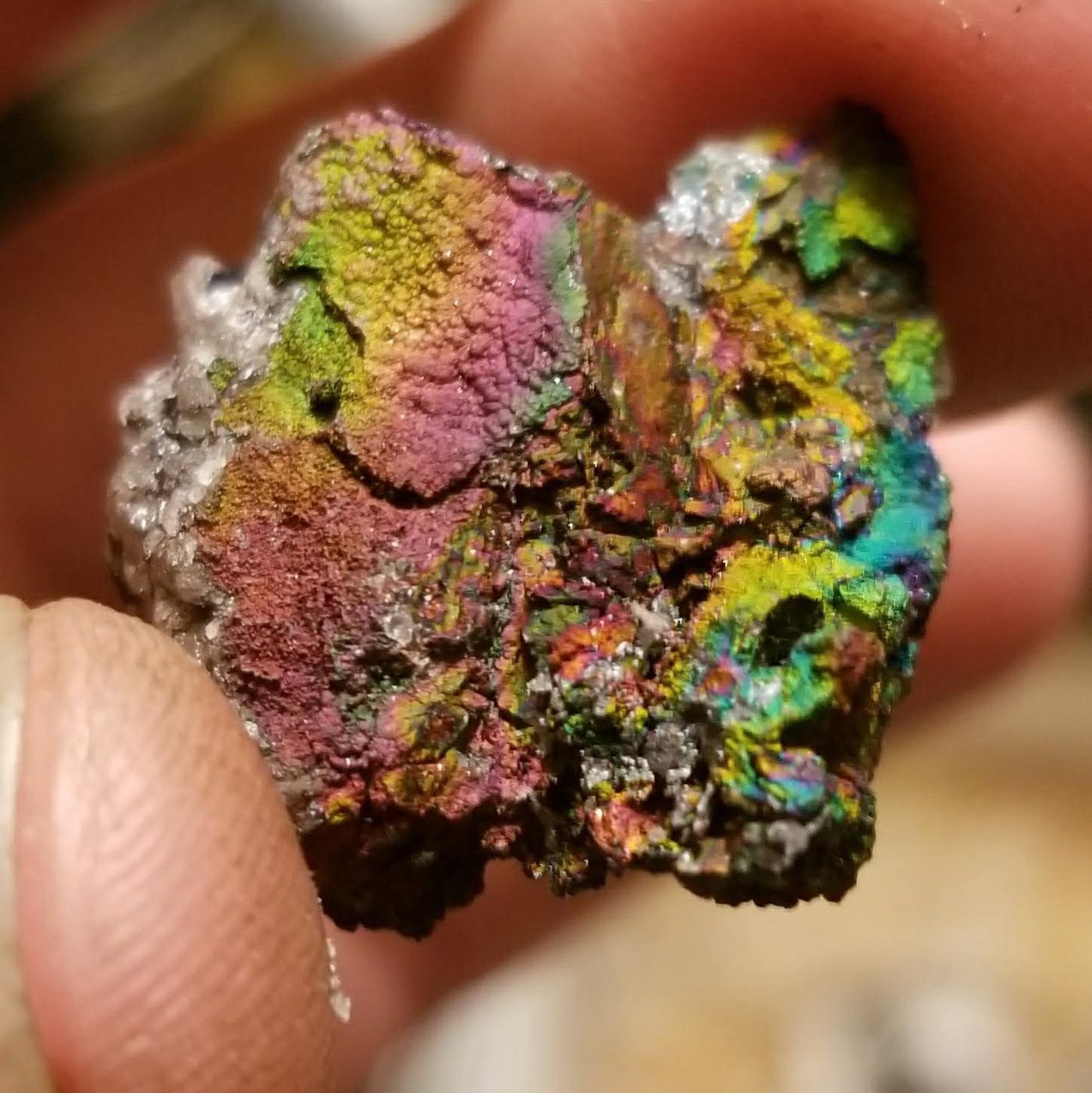 A close-up of an iridescent mineral specimen